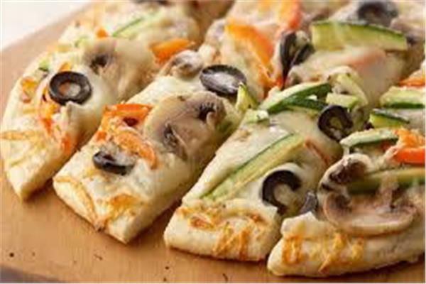 لعشاق البيتزا.. طريقة عمل البيتزا الصيامي 